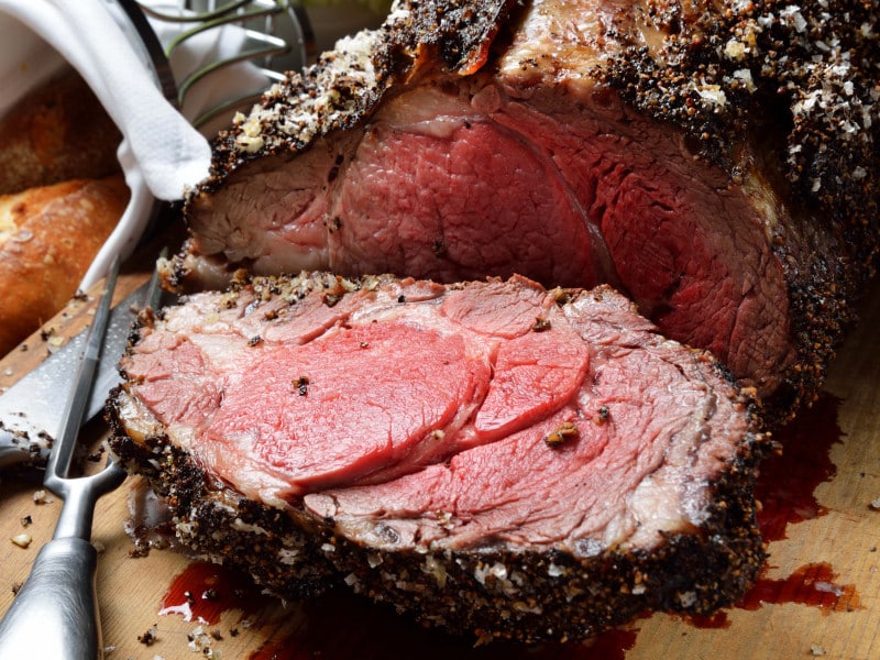 cutting board with Big Toms Steakhouse Prime Rib