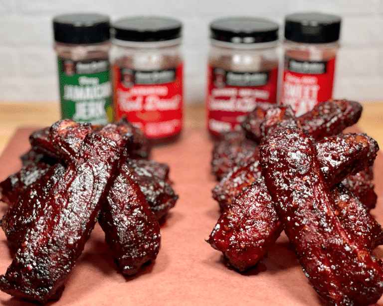 cutting board with sauces, spices and Barbecue Bible Ribs